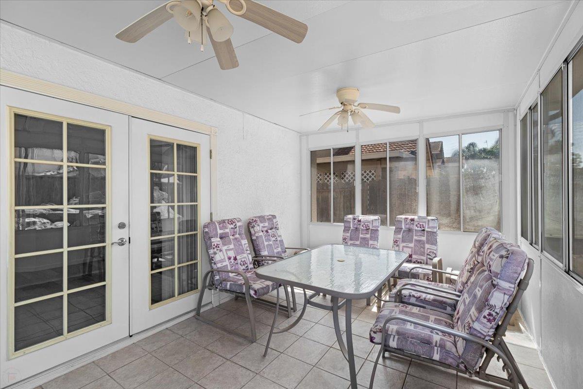 3005 Willetts Way Ceres, CA 95307 - Photo 24 of 29 a dining room with furniture large windows and a chandelier