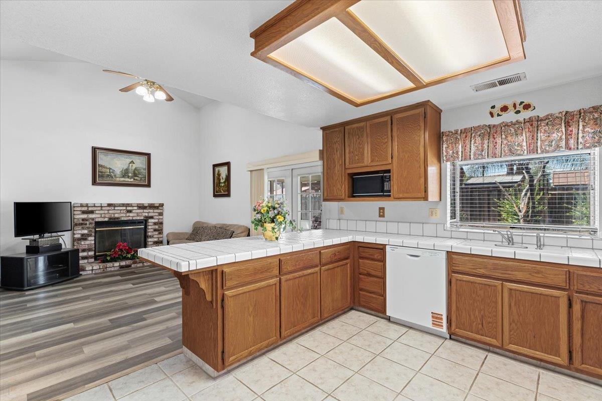 3005 Willetts Way Ceres, CA 95307 - Photo 8 of 29 a kitchen with a sink counter top space and cabinets