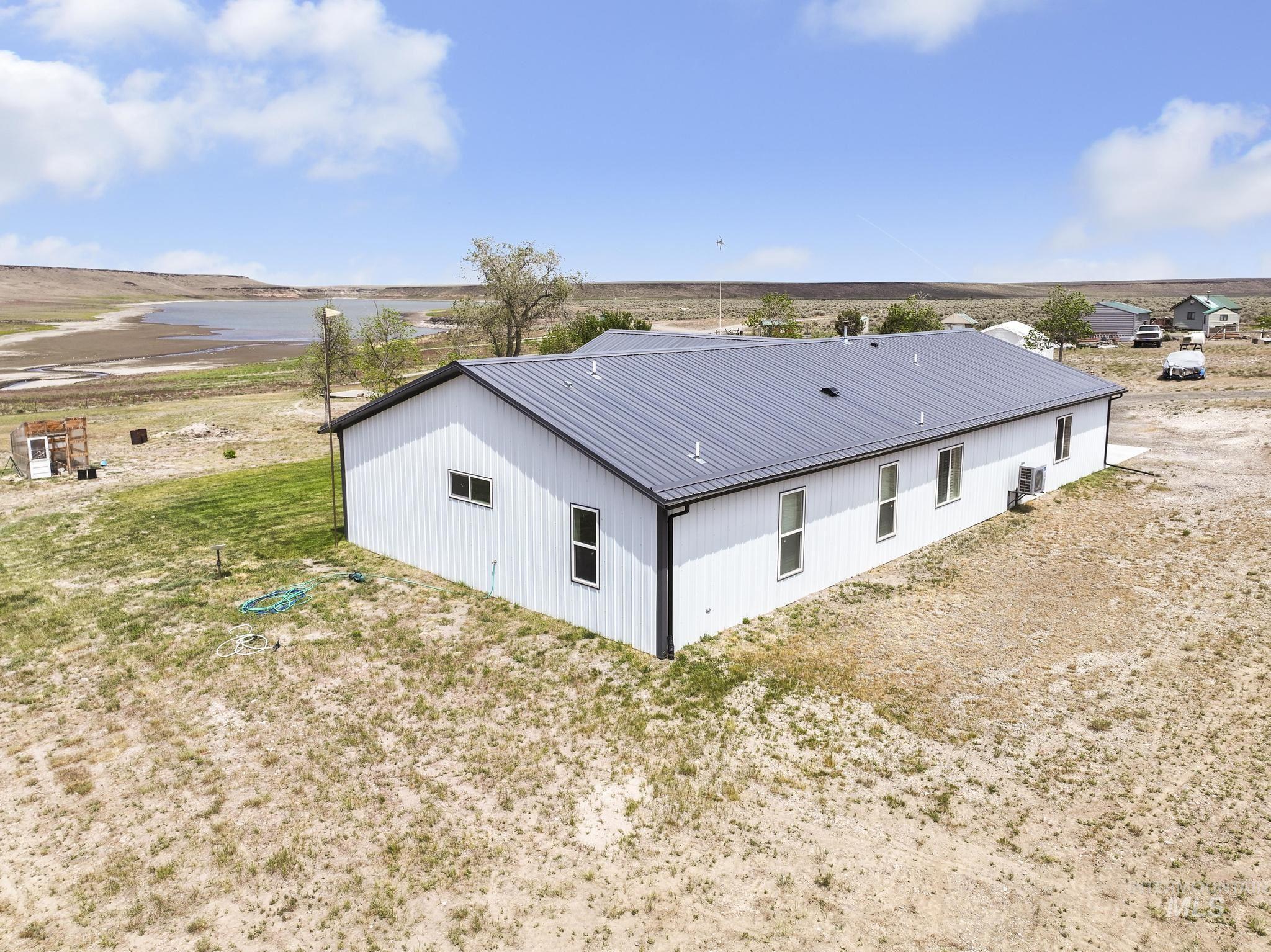 758 Cedar Crk Road Rogerson, ID 83302 - Photo 43 of 50 White metal-sided structure with a dark gray metal roof