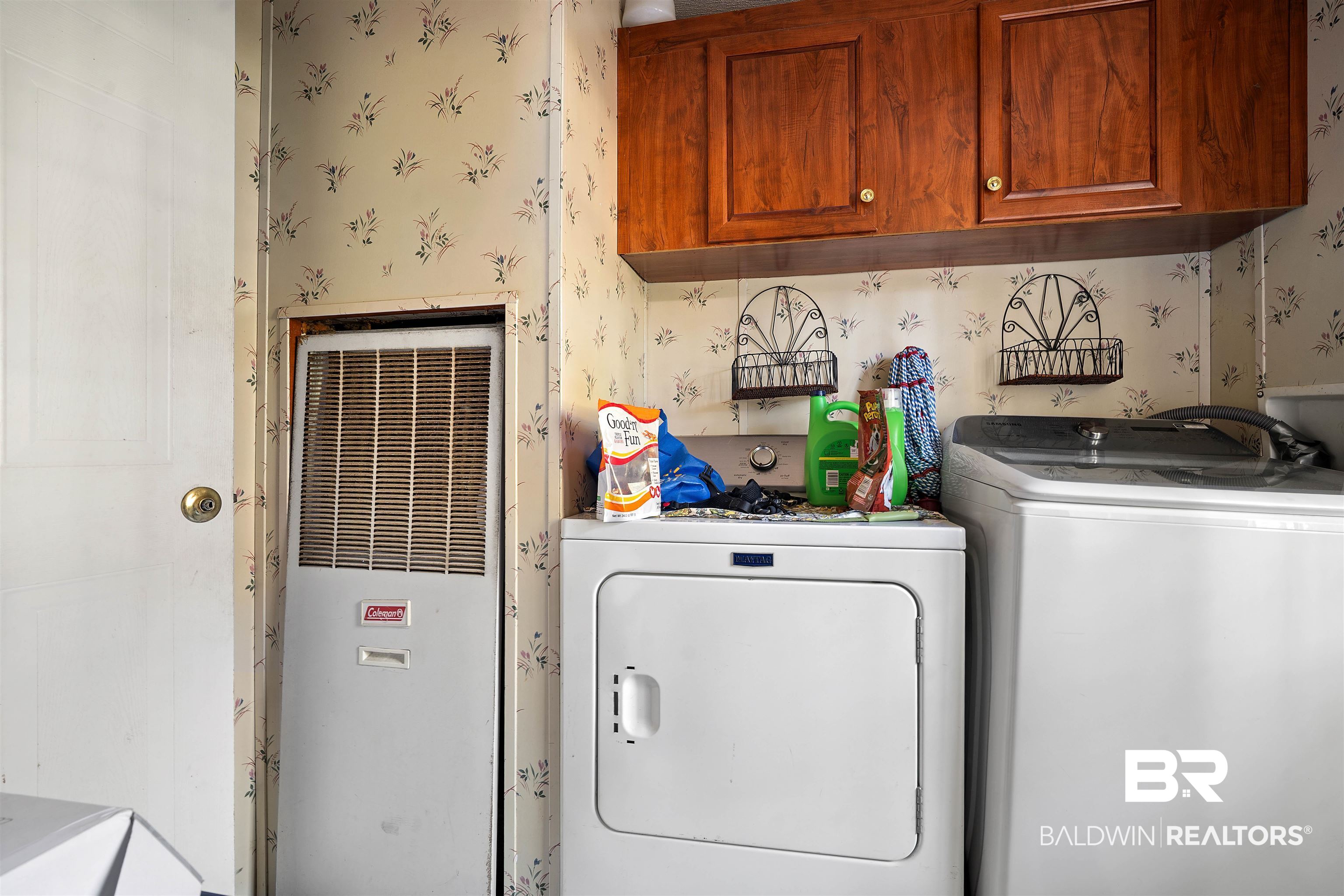 23700 Cumberland Road Robertsdale, AL 36567 - Photo 23 of 33 Laundry room with a heating unit, wallpapered walls, washing machine and dryer, and cabinet space