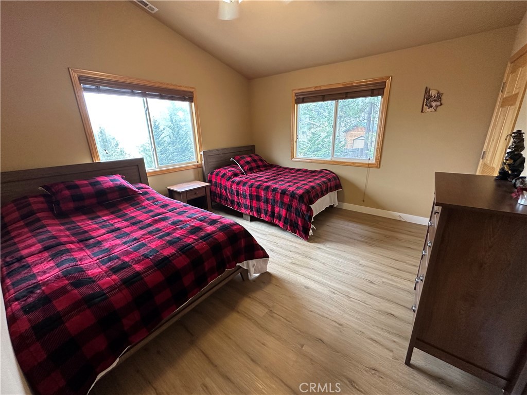 43632 Shasta Road Big Bear Lake, CA 92315 - Photo 16 of 30 a bedroom with two beds and a window