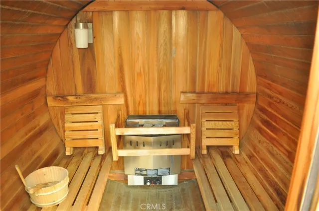 a view of a room with wooden floor and furniture