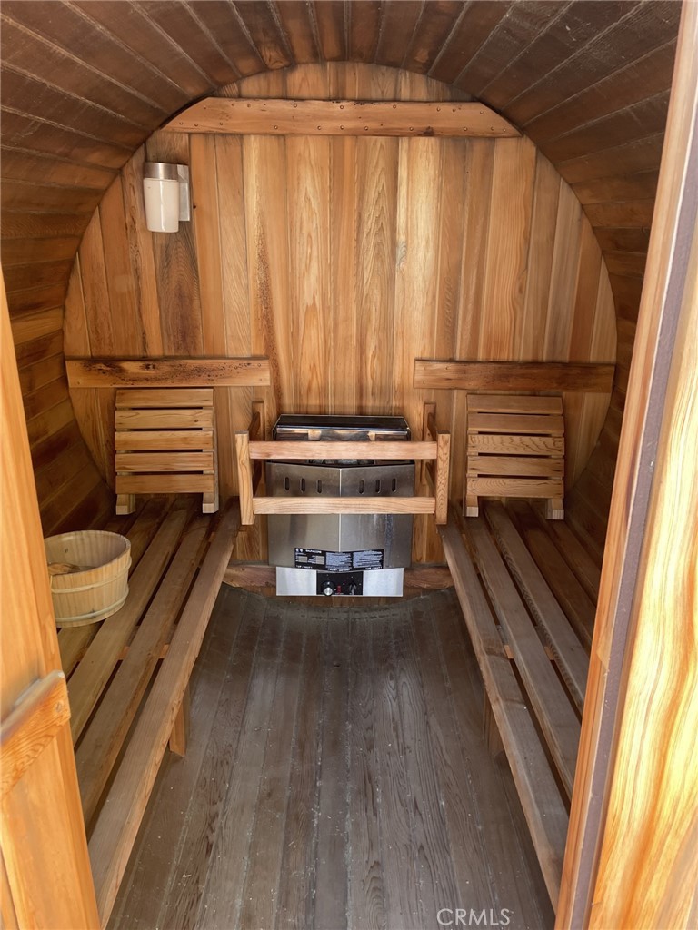 43632 Shasta Road Big Bear Lake, CA 92315 - Photo 18 of 30 a view of a balcony with chairs and wooden floor