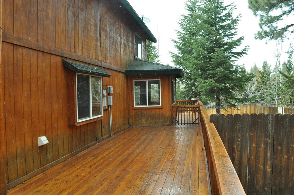 43632 Shasta Road Big Bear Lake, CA 92315 - Photo 22 of 30 a view of balcony with wooden floor and fence