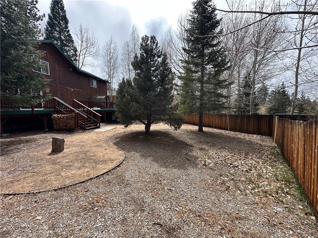 43632 Shasta Road Big Bear Lake, CA 92315 - Photo 25 of 30 a view of a backyard with wooden fence