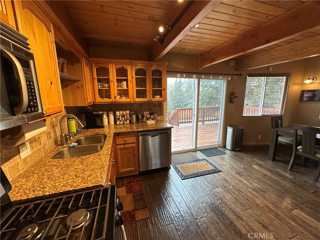 43632 Shasta Road Big Bear Lake, CA 92315 - Photo 7 of 30 a view of a porch with furniture and wooden floor