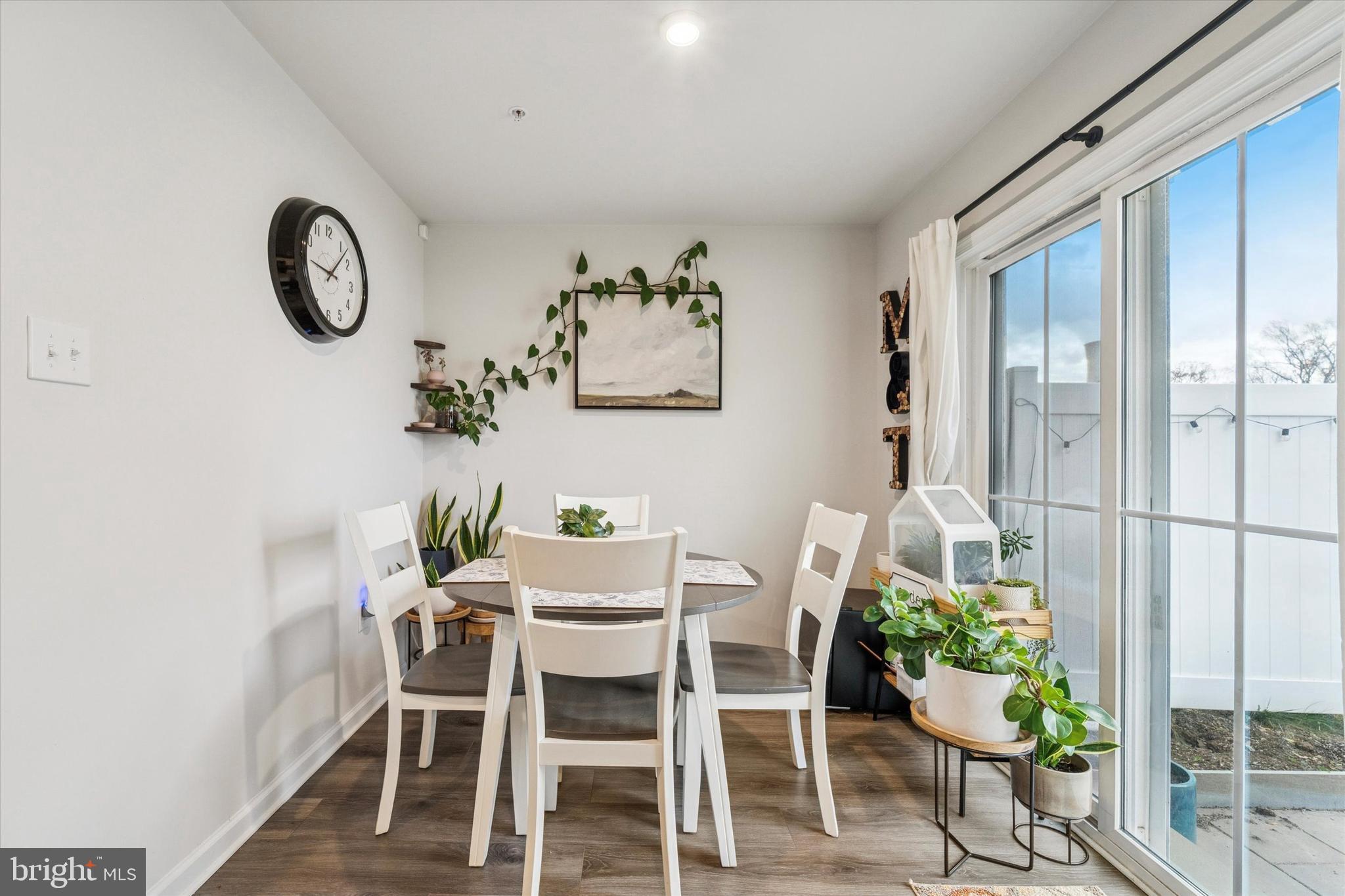 139 Nelson Lane Pottstown, PA 19464 - Photo 6 of 18 a dining room with furniture potted plants and wooden floor