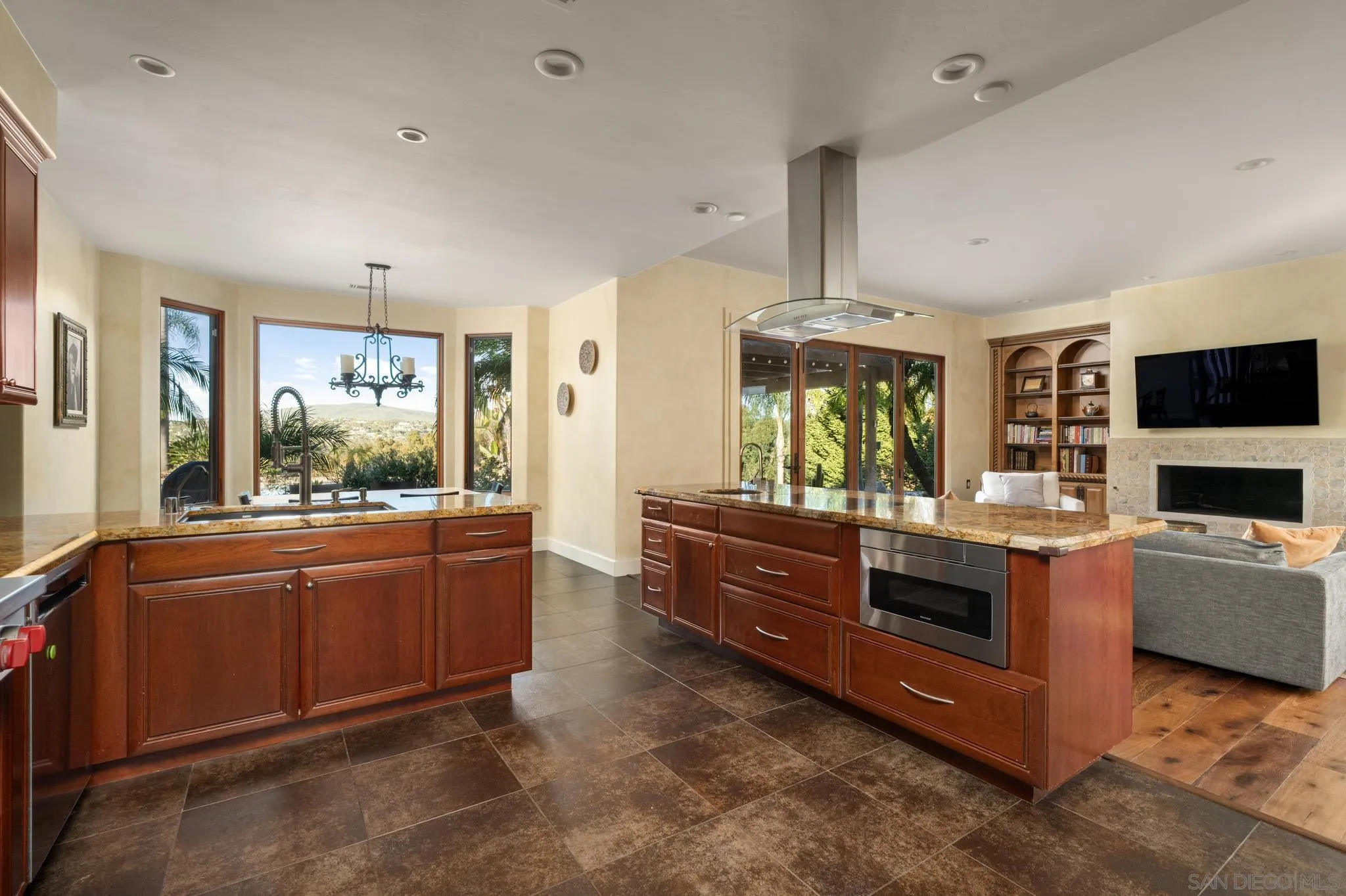 3028 Paseo Cielo Rancho Santa Fe, CA 92024 - Photo 14 of 50 a large kitchen with stainless steel appliances granite countertop a stove and a sink