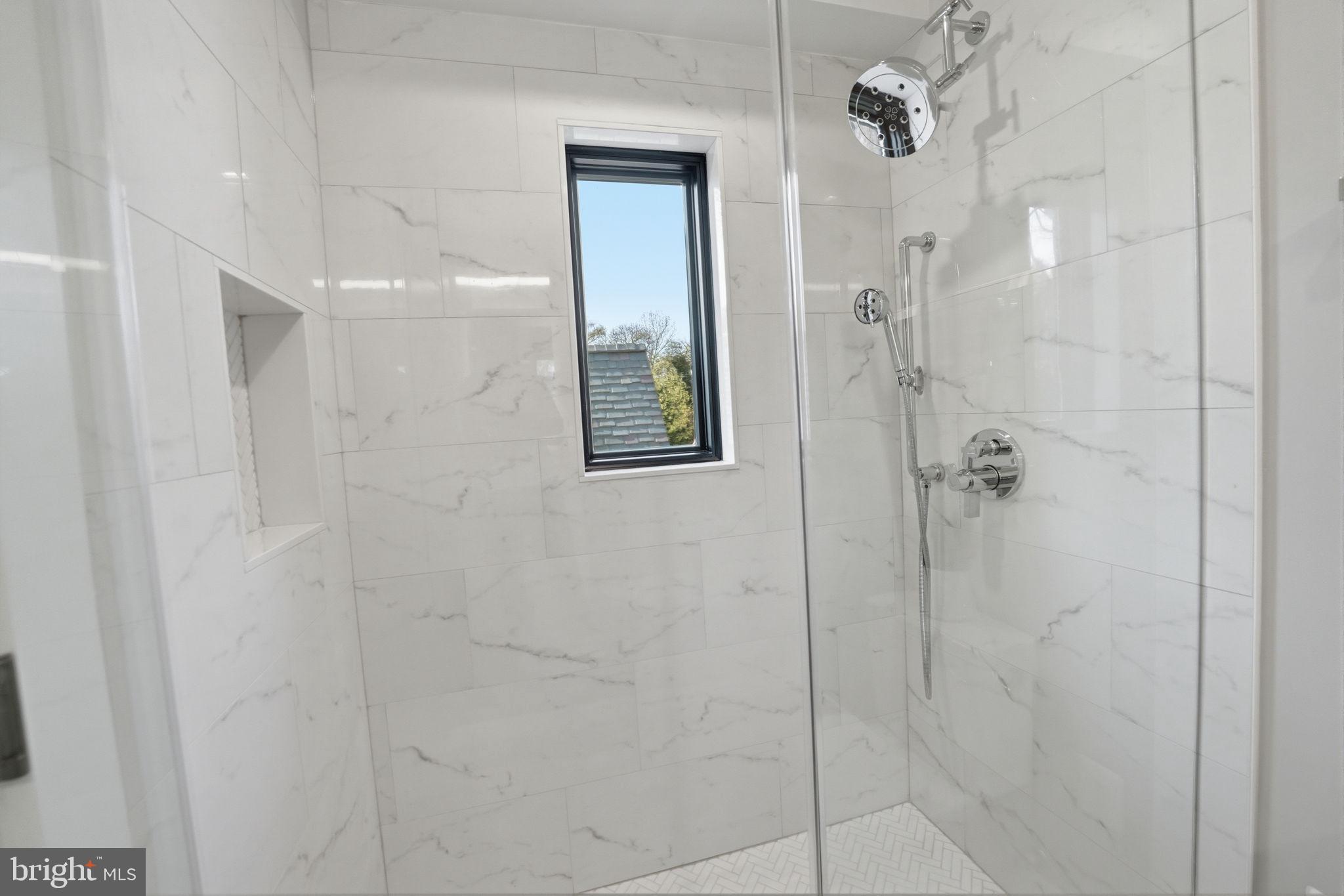 2211 Military Road Arlington, VA 22207 - Photo 70 of 107 Sleek modern shower with natural light.