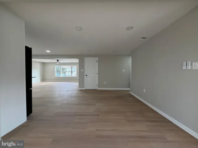 a view of an empty room and a window