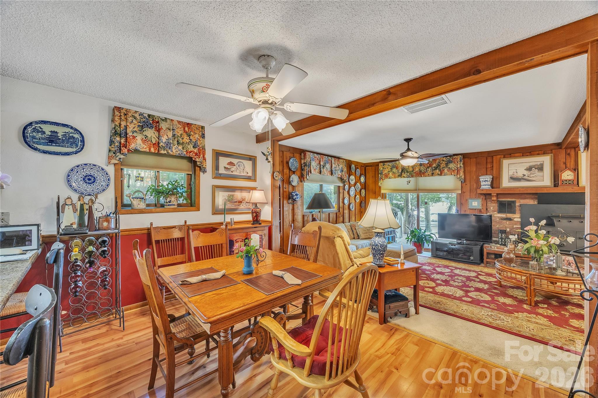 630 Mainsail Road Salisbury, NC 28146 - Photo 11 of 44 a dining room with furniture a rug and a chandelier