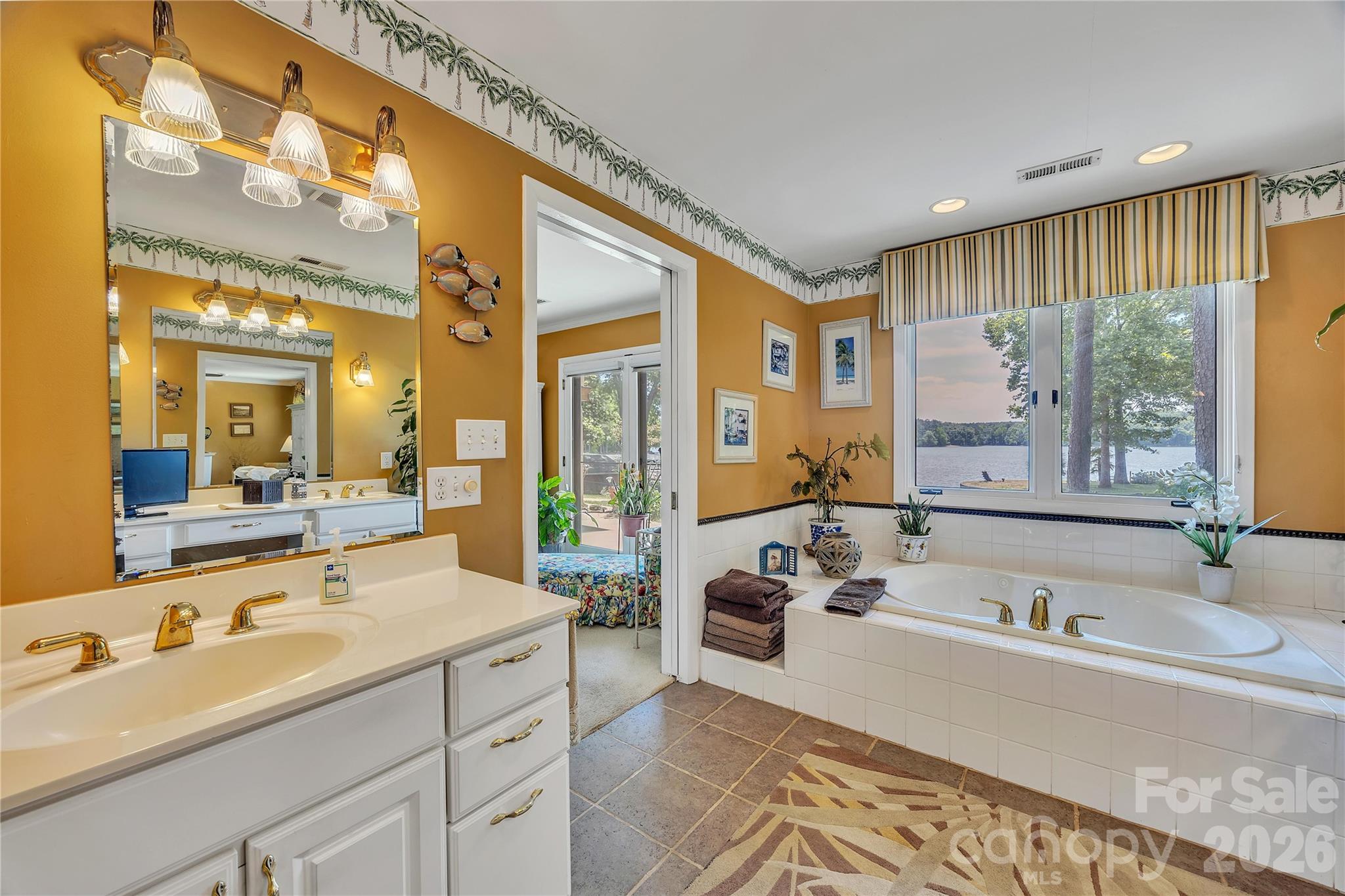 630 Mainsail Road Salisbury, NC 28146 - Photo 20 of 44 a spacious bathroom with a tub sink and mirror