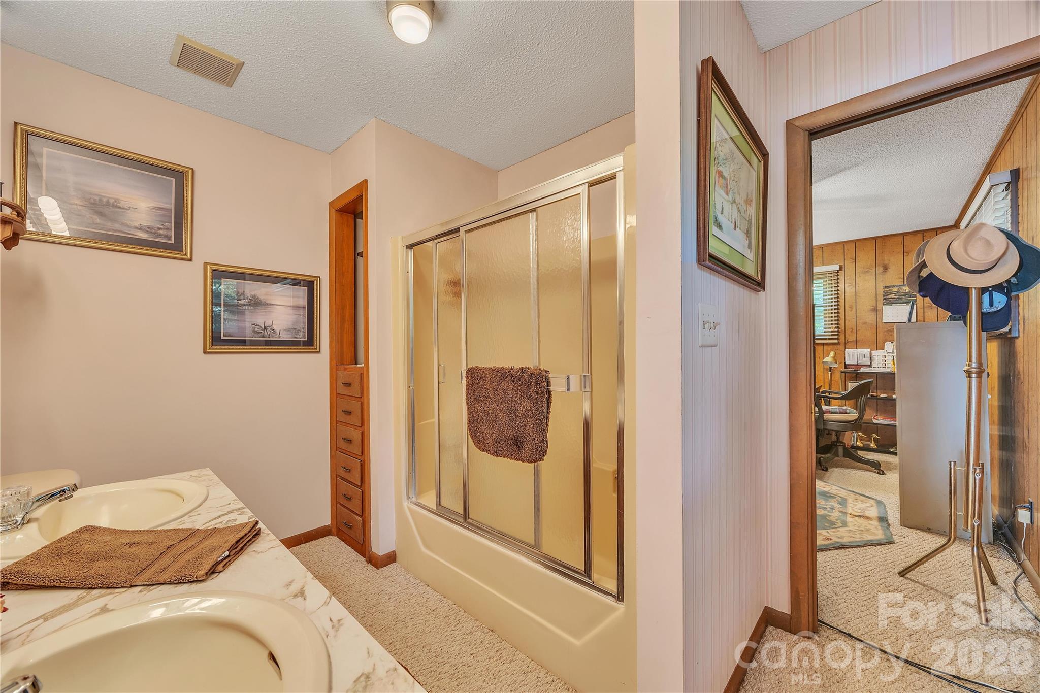 630 Mainsail Road Salisbury, NC 28146 - Photo 27 of 44 a bedroom with a bed and glass door