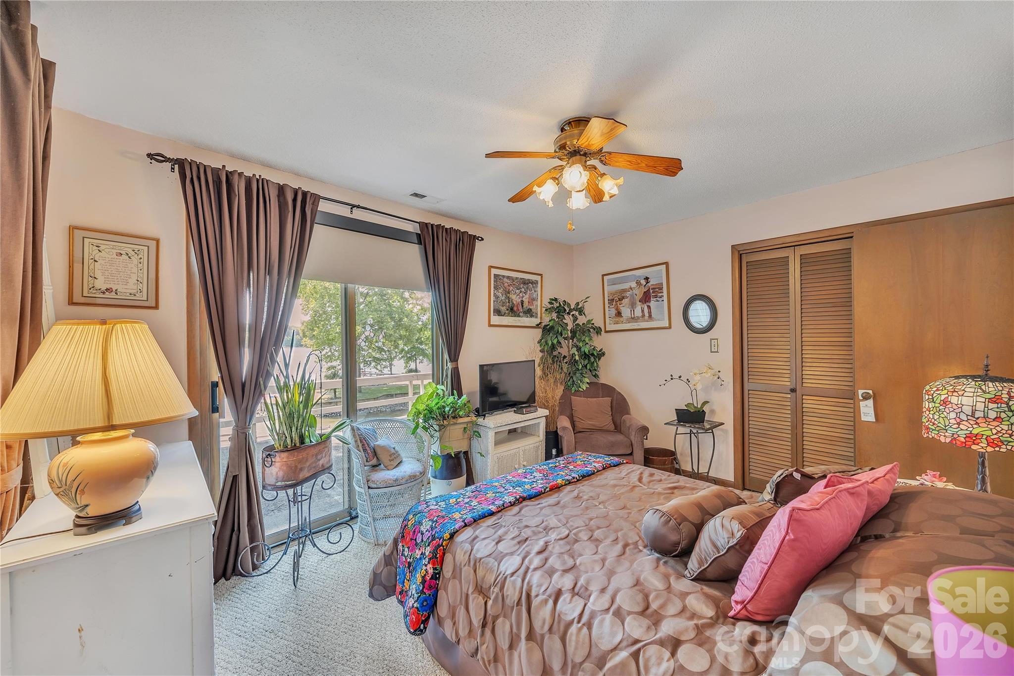 630 Mainsail Road Salisbury, NC 28146 - Photo 28 of 44 a bedroom with a bed and a chandelier