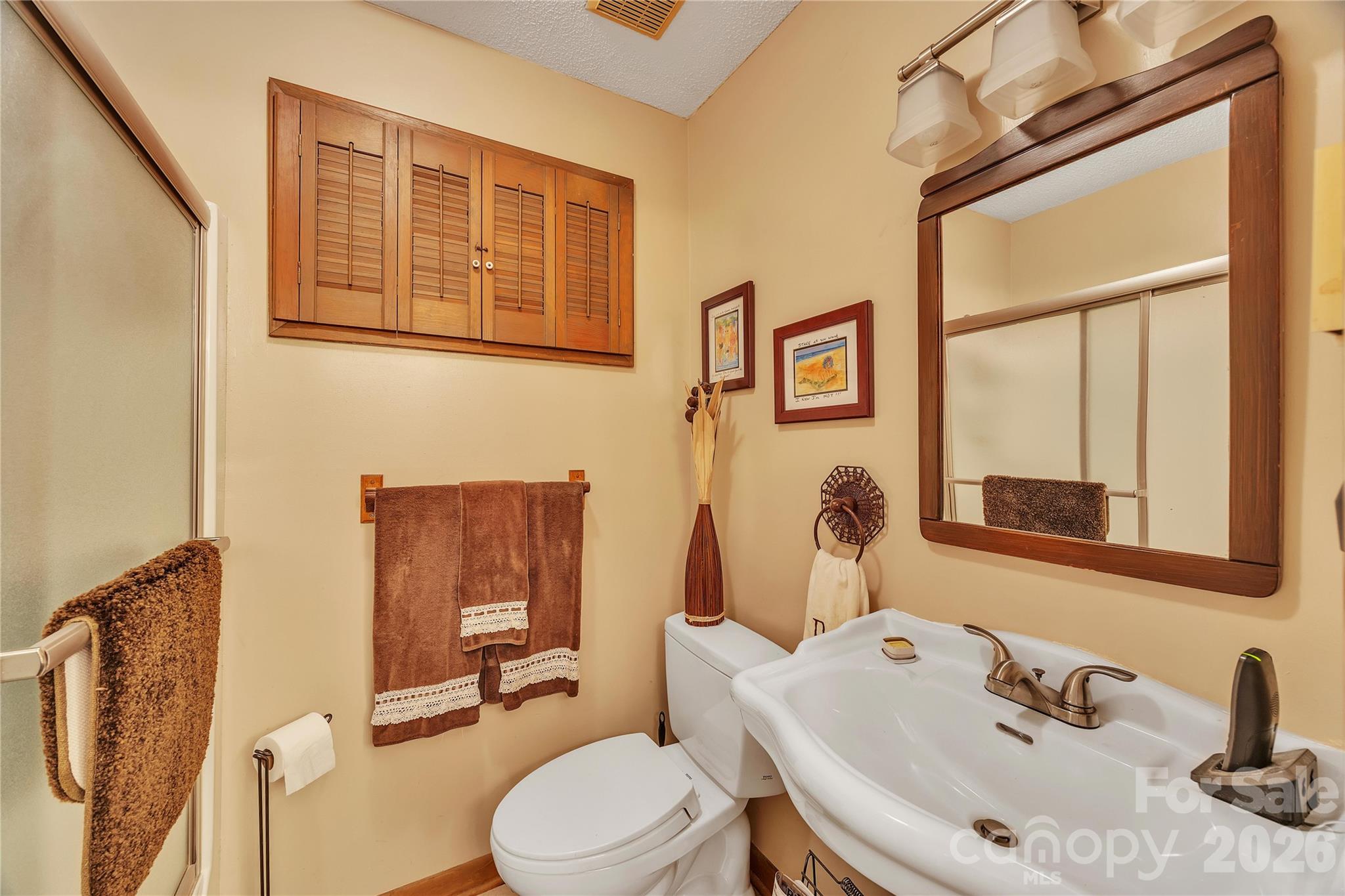 630 Mainsail Road Salisbury, NC 28146 - Photo 35 of 44 a bathroom with a sink and a mirror