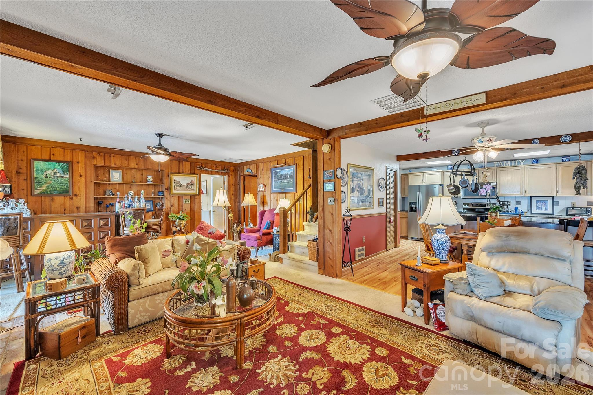 630 Mainsail Road Salisbury, NC 28146 - Photo 37 of 44 a living room with lots of chairs and a chandelier