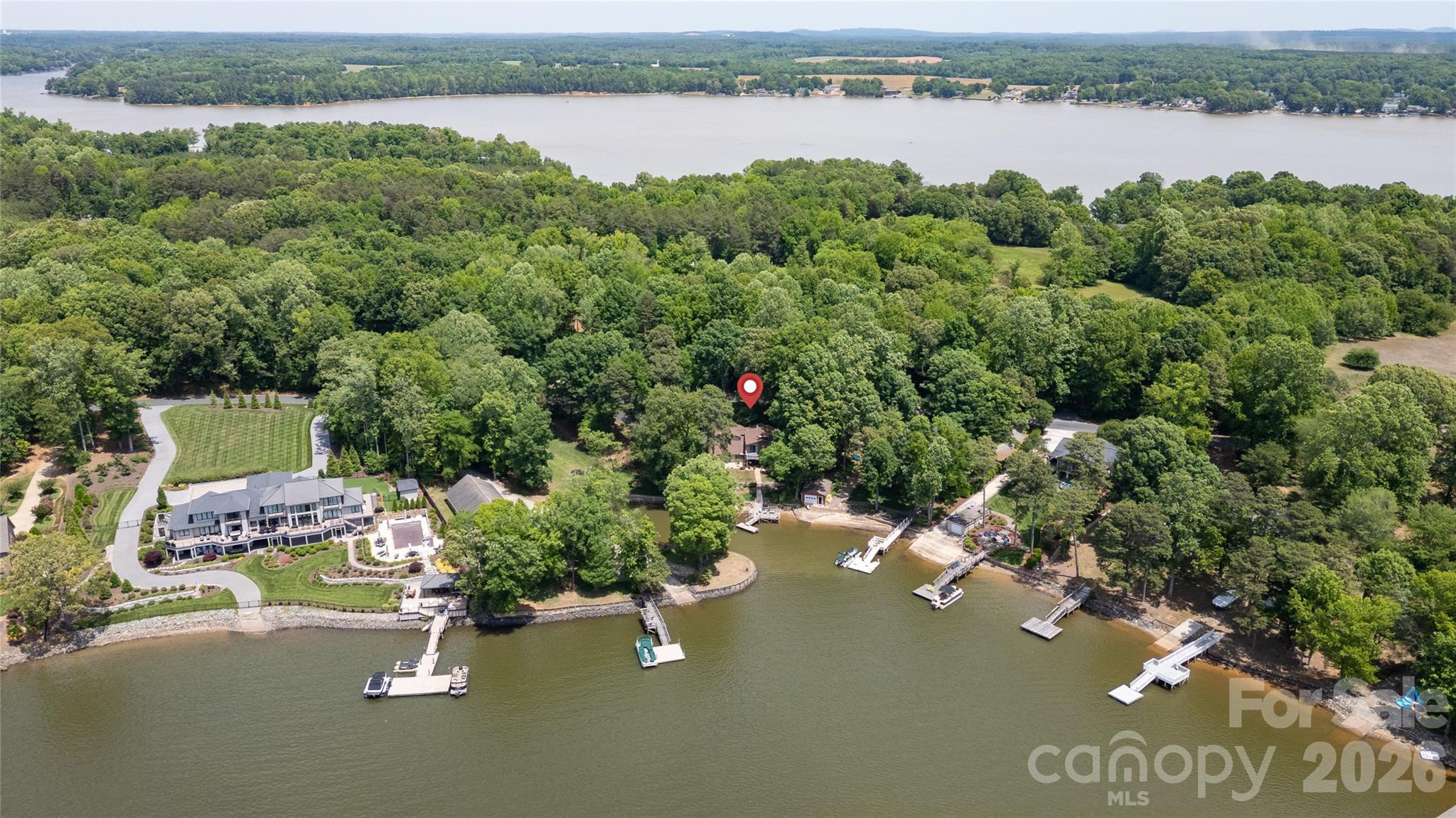 630 Mainsail Road Salisbury, NC 28146 - Photo 40 of 44 an aerial view of a house with a garden and lake view