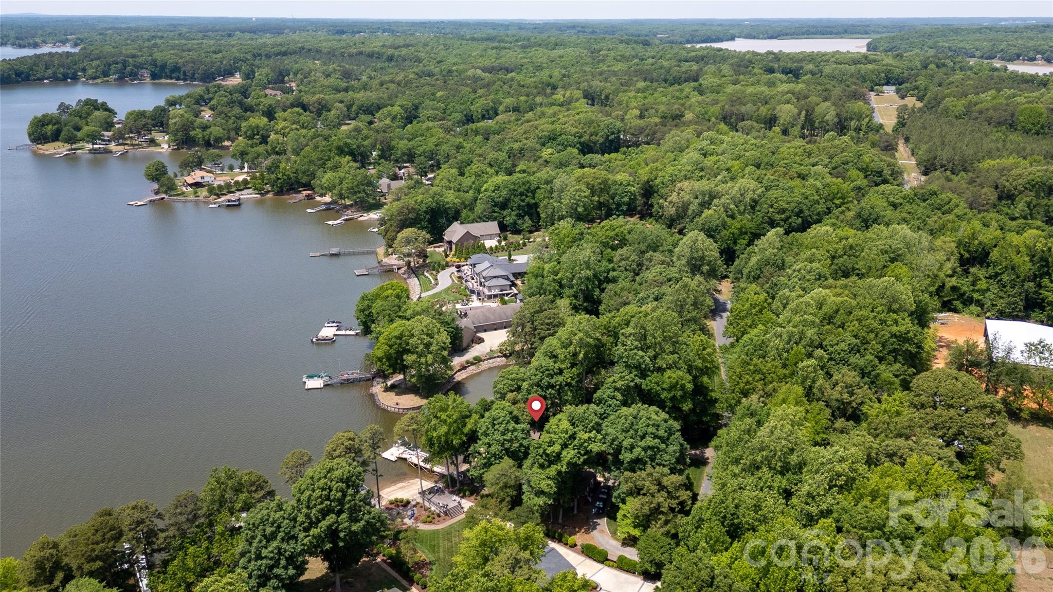 630 Mainsail Road Salisbury, NC 28146 - Photo 41 of 44 an aerial view of a house with a yard and lake view