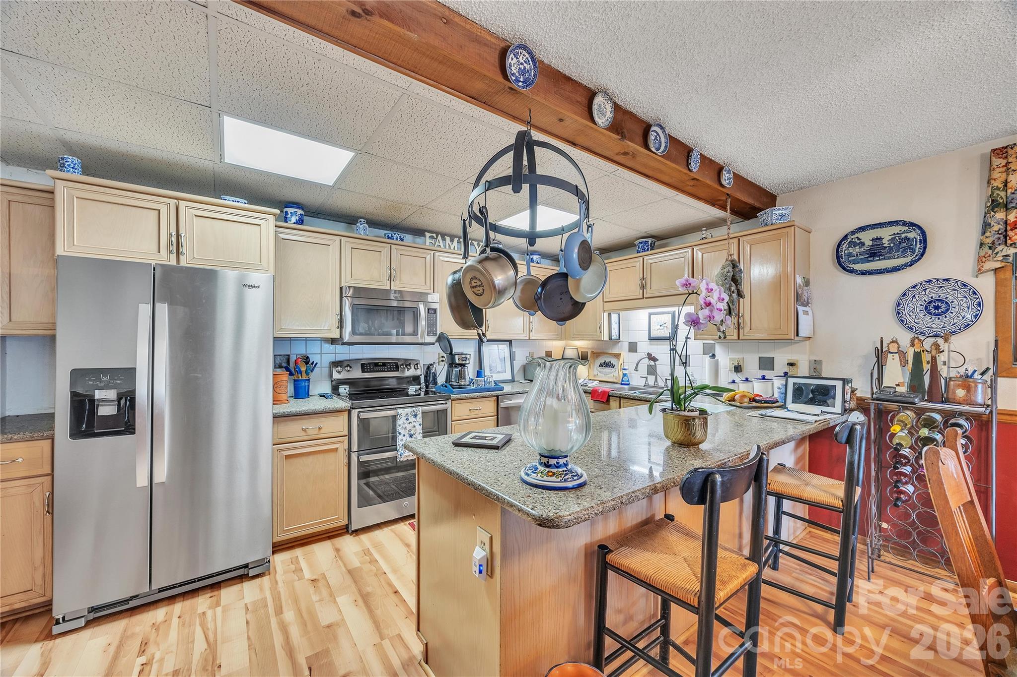 630 Mainsail Road Salisbury, NC 28146 - Photo 5 of 44 a kitchen with stainless steel appliances granite countertop a sink and a refrigerator