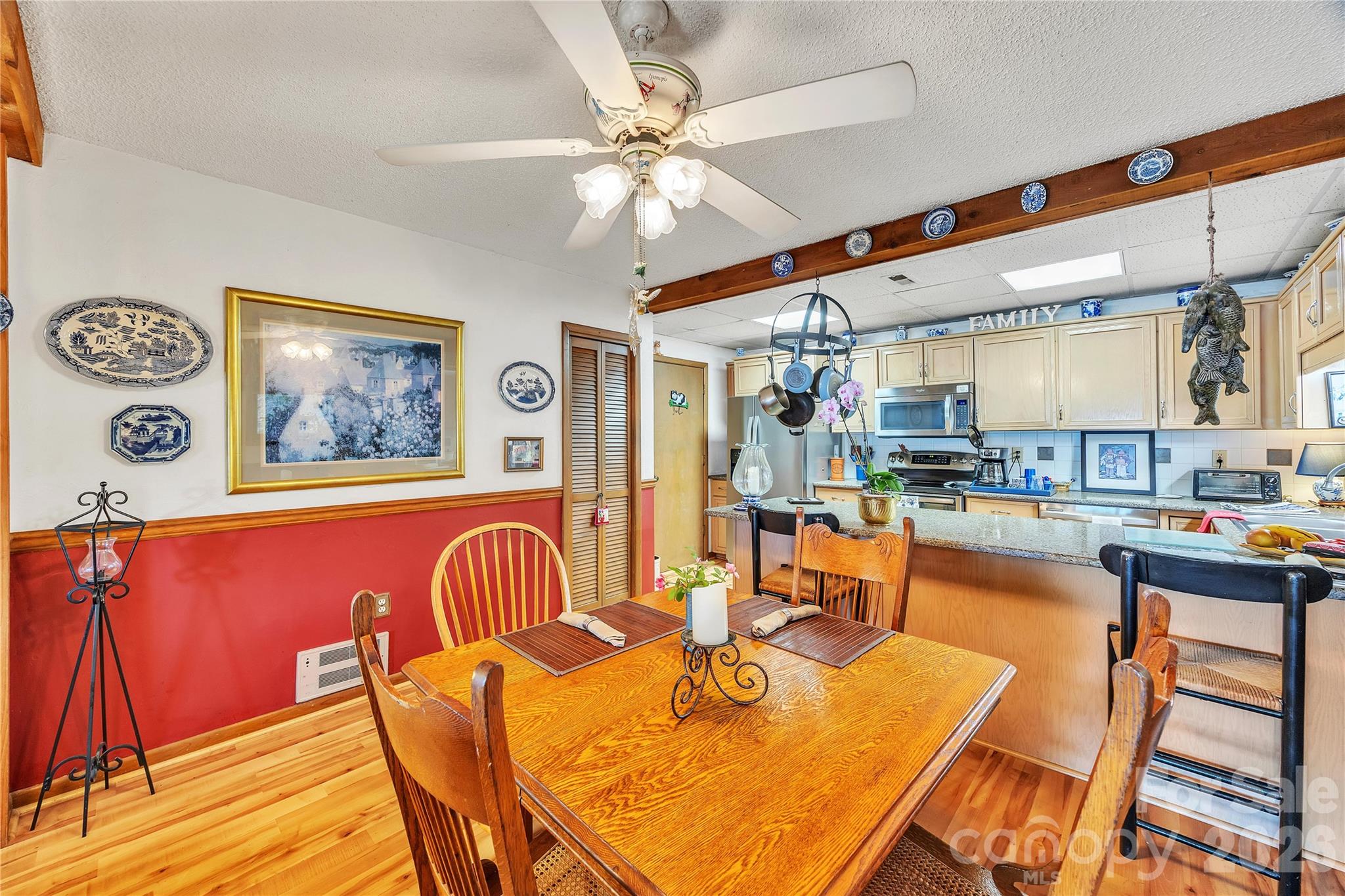 630 Mainsail Road Salisbury, NC 28146 - Photo 10 of 44 a dining room with furniture and wooden floor