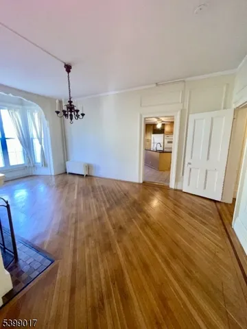 a large kitchen with granite countertop a stove a sink and a granite counter tops