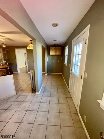 a view of pool and porch with wooden floor