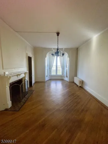 a view of a livingroom with wooden floor