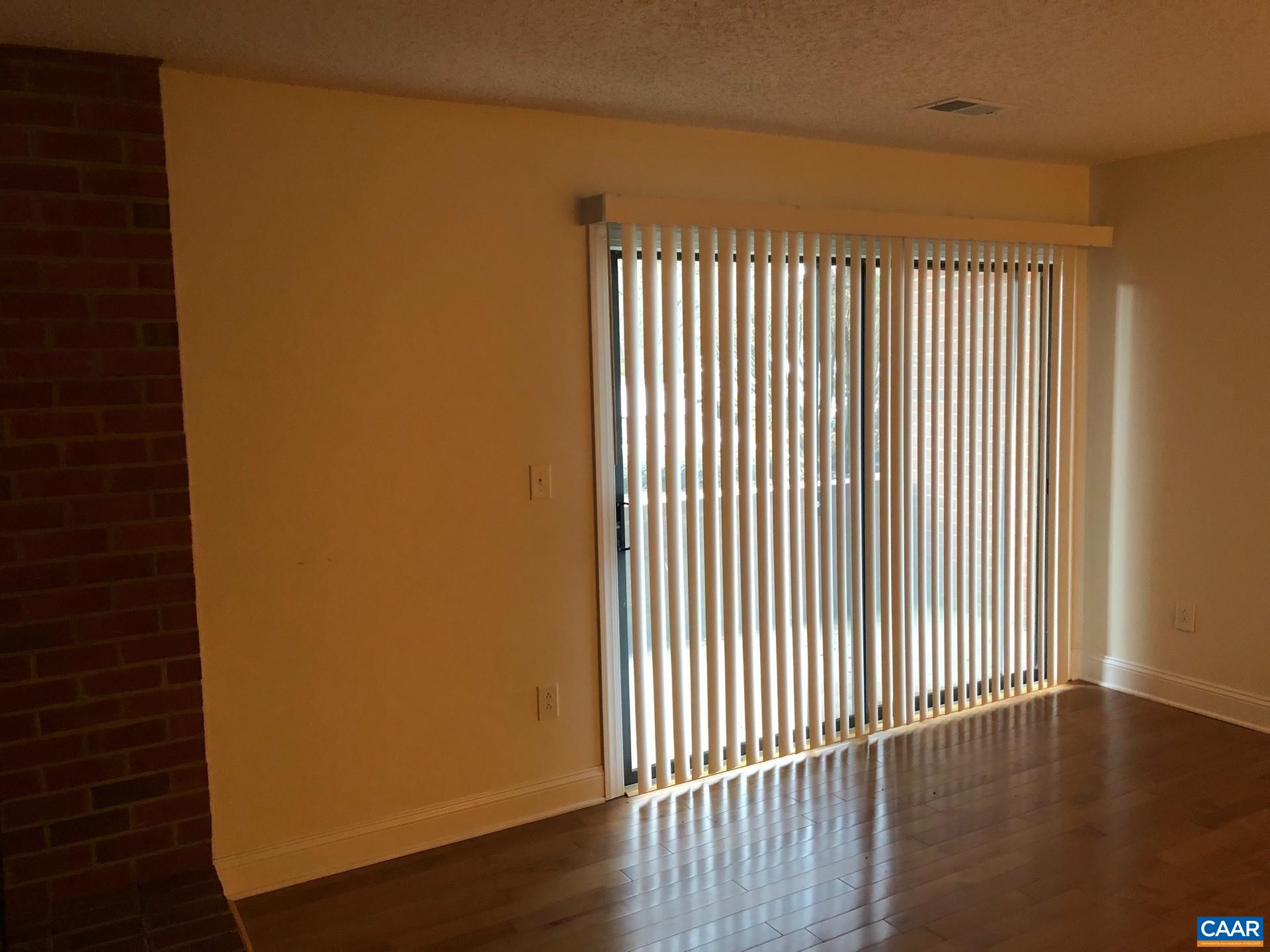 110 Turtle Creek Road, Unit 4 Charlottesville, VA 22901 - Photo 2 of 3 a view of a room with wooden floor