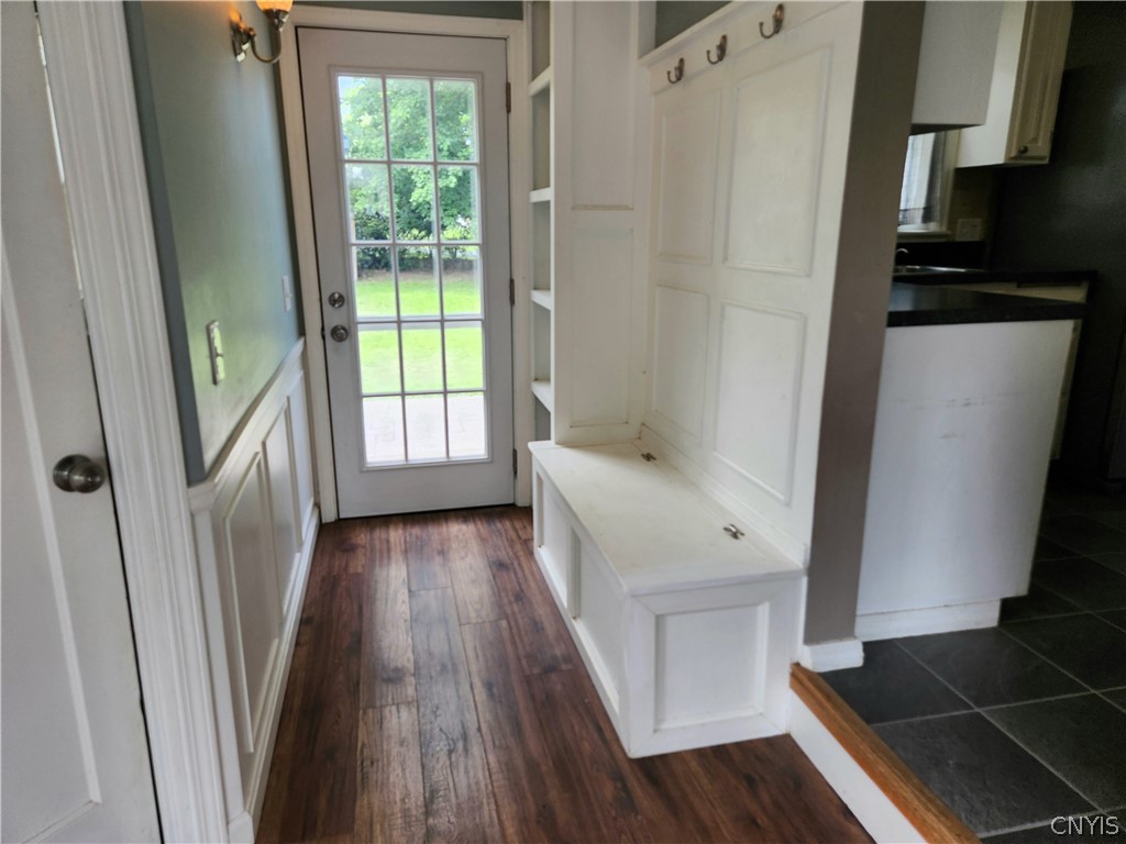 200 Windemere Road Syracuse, NY 13219 - Photo 13 of 29 Step down from Kitchen into the back hall w/storage bench, coat hooks & cubbies, and access to the Patio & backyard