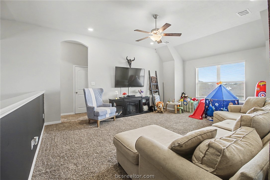 2111 Markley Drive Bryan, TX 77807 - Photo 19 of 30 a living room with furniture and a flat screen tv