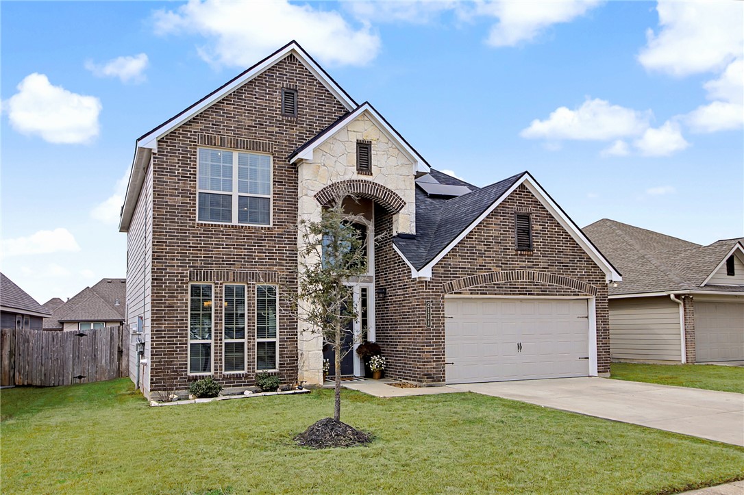 2111 Markley Drive Bryan, TX 77807 - Photo 2 of 30 a front view of a house with a yard