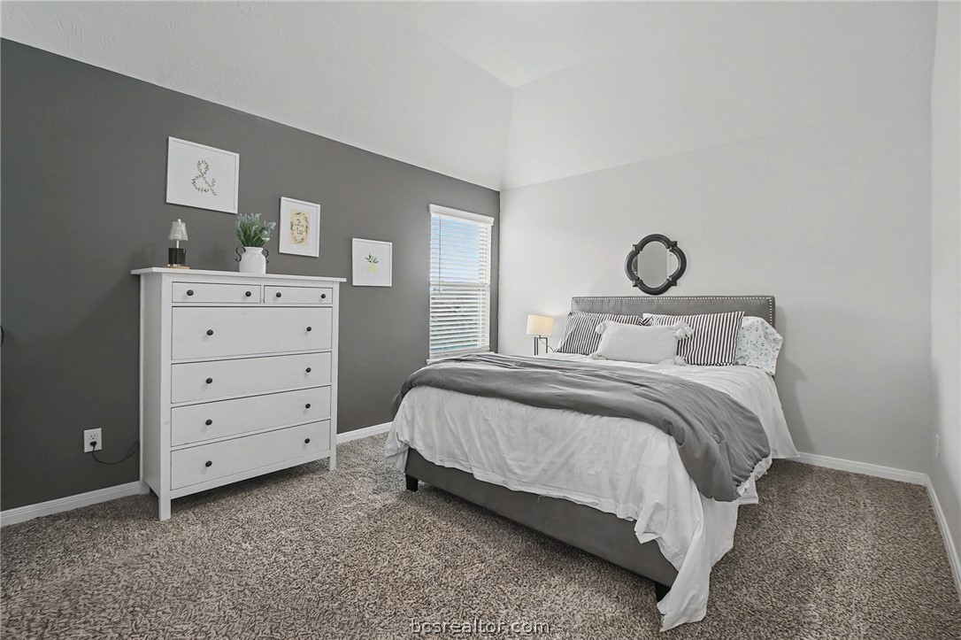 2111 Markley Drive Bryan, TX 77807 - Photo 22 of 30 a bedroom with a bed and a dresser