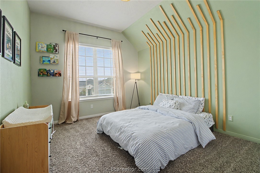 2111 Markley Drive Bryan, TX 77807 - Photo 24 of 30 a bedroom with a bed and window