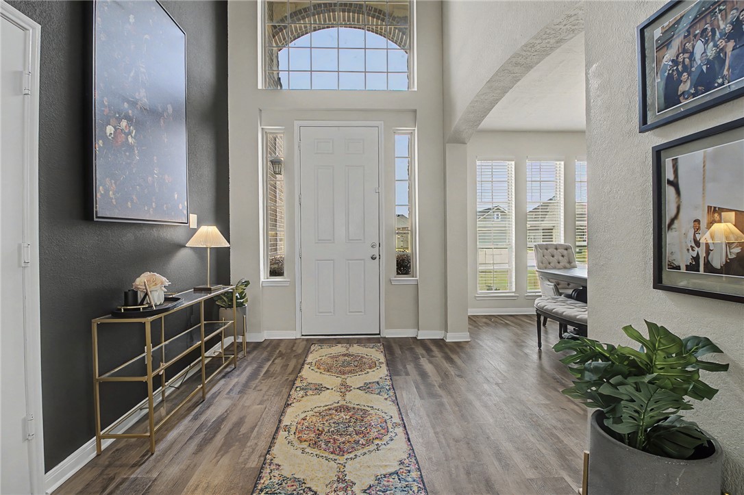2111 Markley Drive Bryan, TX 77807 - Photo 4 of 30 view of hall way with furniture and wooden floor
