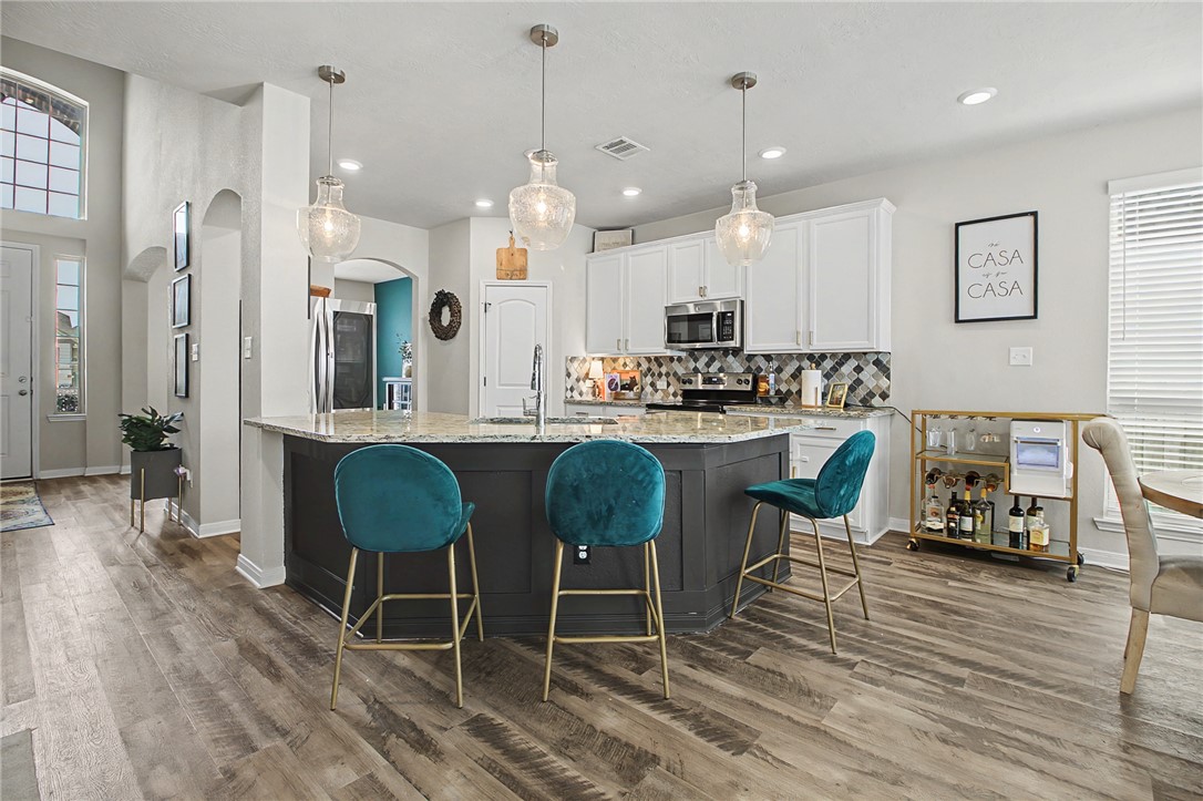 2111 Markley Drive Bryan, TX 77807 - Photo 9 of 30 a large kitchen with a table and chairs