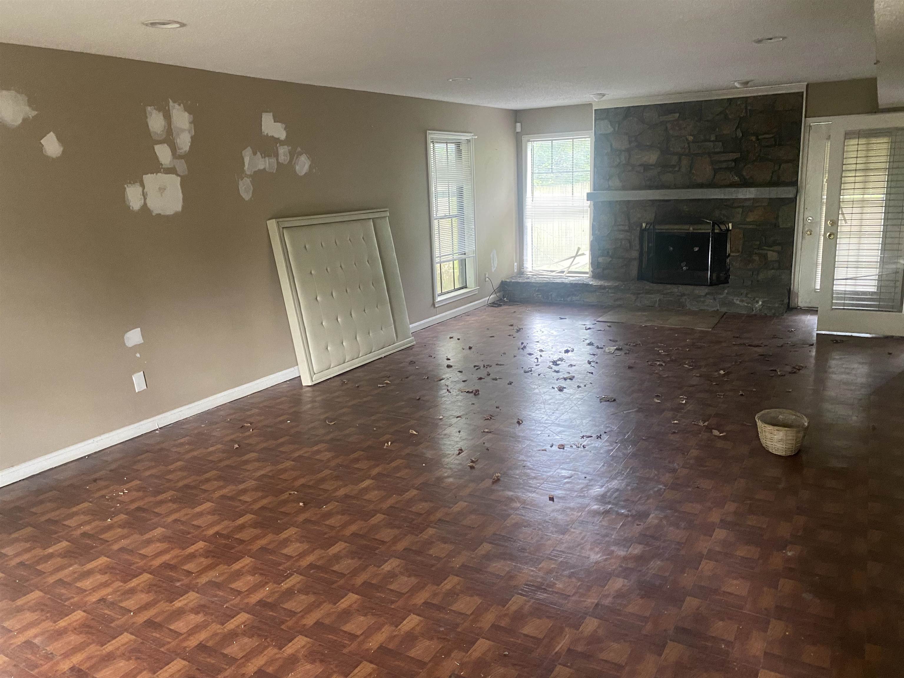 3051 Knight Road Memphis, TN 38118 - Photo 4 of 18 an empty room with windows and fireplace