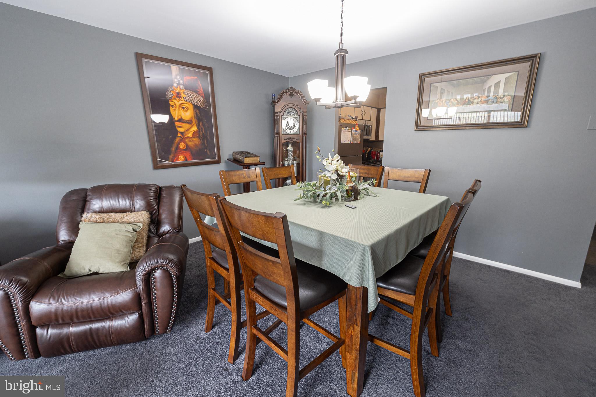 1680 Huntingdon Pike, Unit 210 Huntingdon Valley, PA 19006 - Photo 18 of 36 a view of a dining room with furniture and chandelier