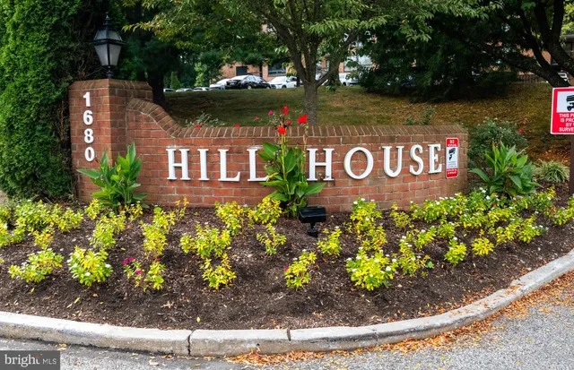 a front view of a building with garden