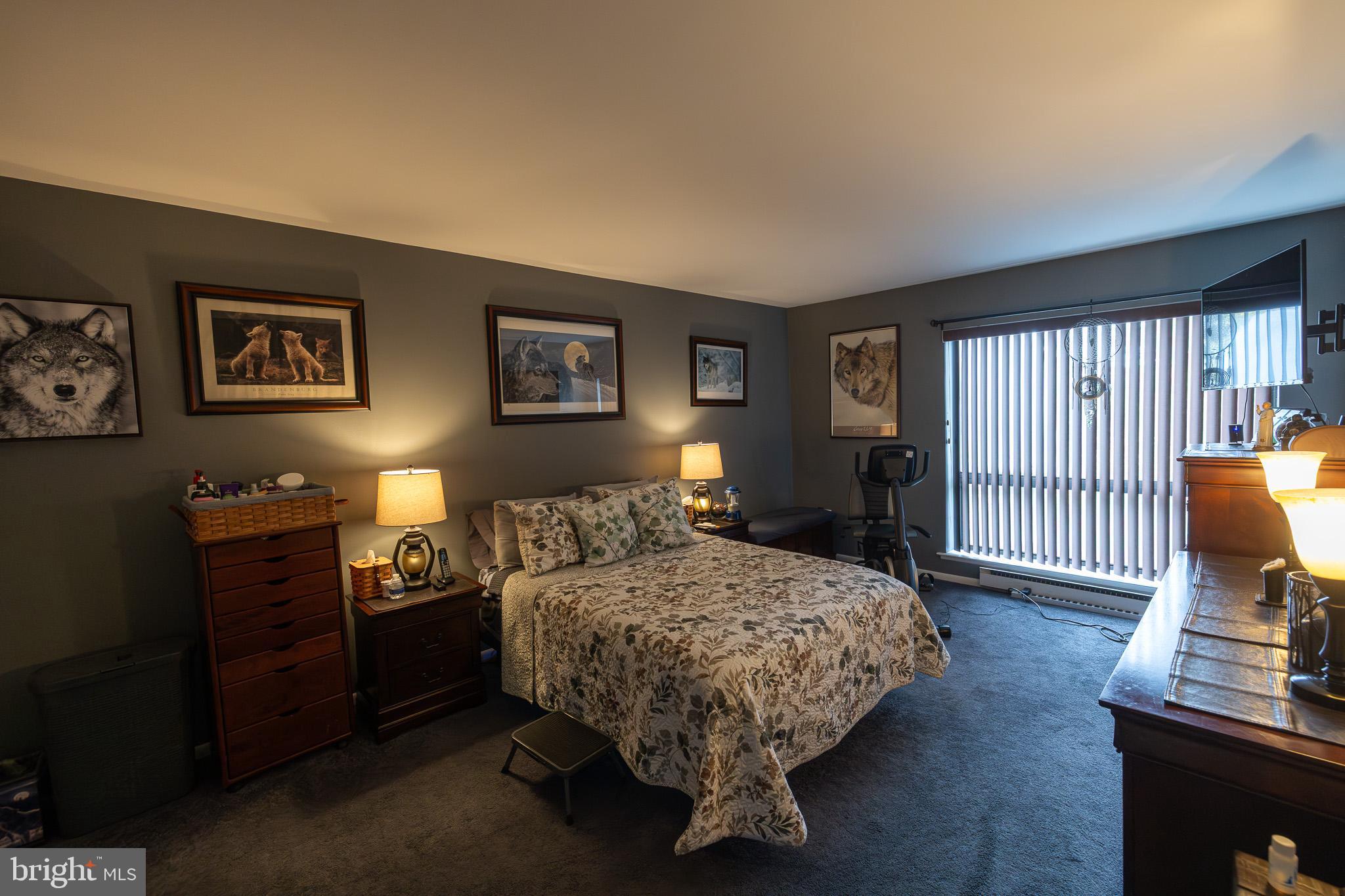 1680 Huntingdon Pike, Unit 210 Huntingdon Valley, PA 19006 - Photo 23 of 36 a bedroom with a bed and wooden floor