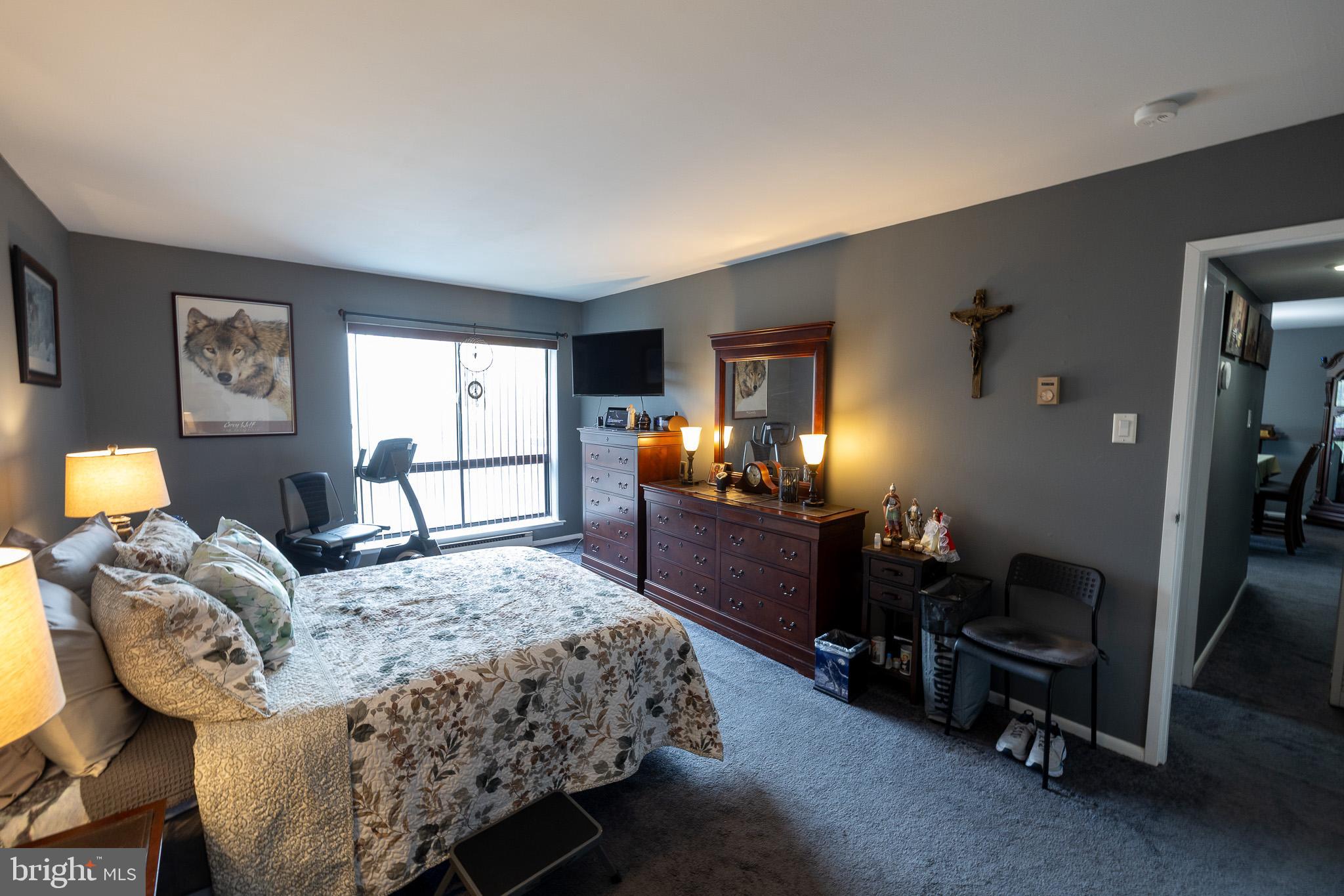 1680 Huntingdon Pike, Unit 210 Huntingdon Valley, PA 19006 - Photo 24 of 36 a bedroom with a bed and dresser