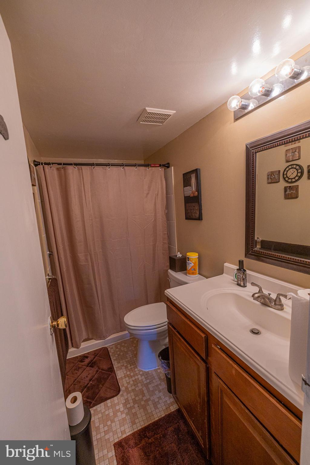 1680 Huntingdon Pike, Unit 210 Huntingdon Valley, PA 19006 - Photo 29 of 36 a bathroom with a sink and a mirror