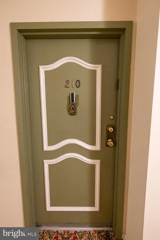 a living room with furniture potted plant and a flat screen tv