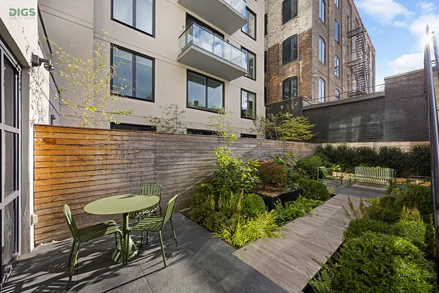 a backyard of a house with outdoor seating