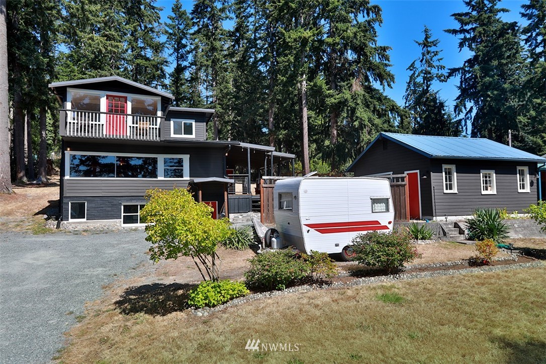 5837 Mutiny Bay Road Freeland, WA 98249 - Photo 2 of 40 a front view of a house with garden