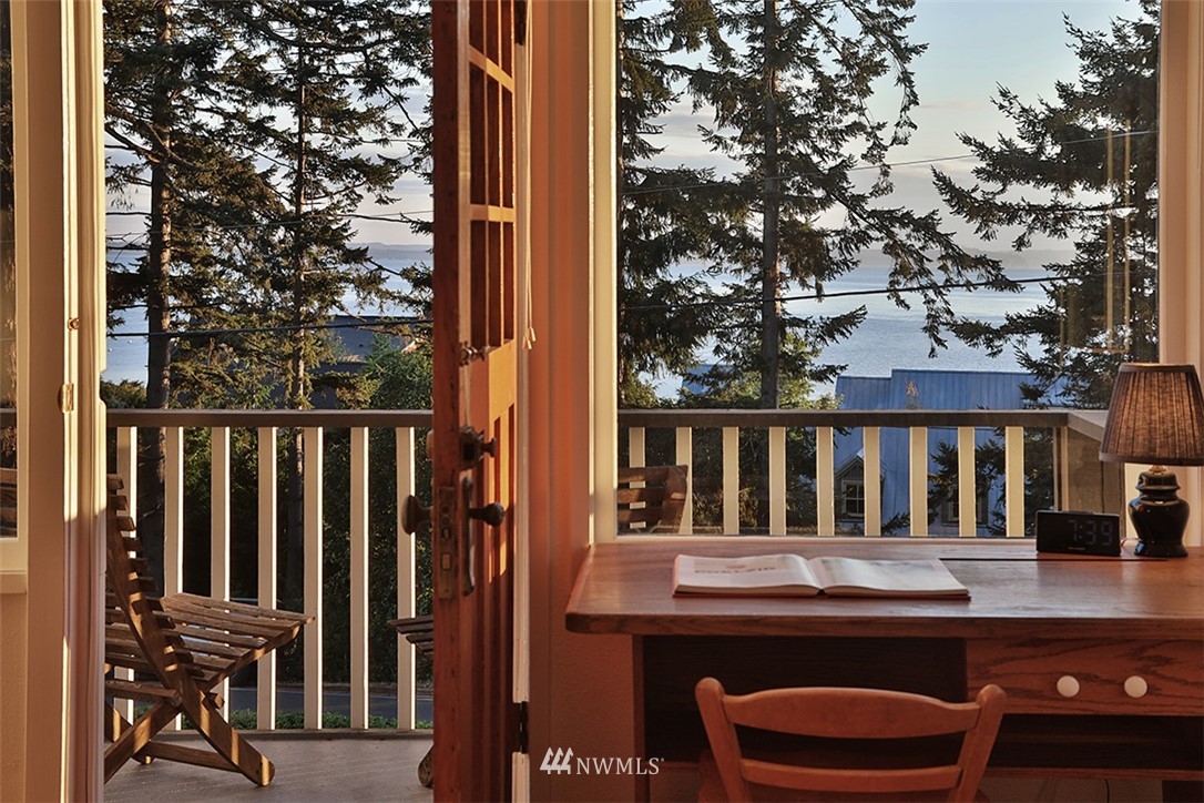 5837 Mutiny Bay Road Freeland, WA 98249 - Photo 22 of 40 a view of a chair and table in the balcony