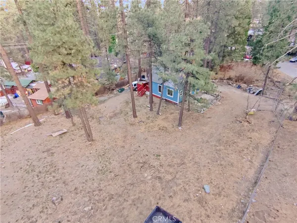 a view of a park with iron fence