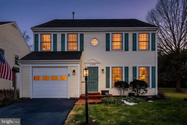 a front view of house with yard and outdoor seating