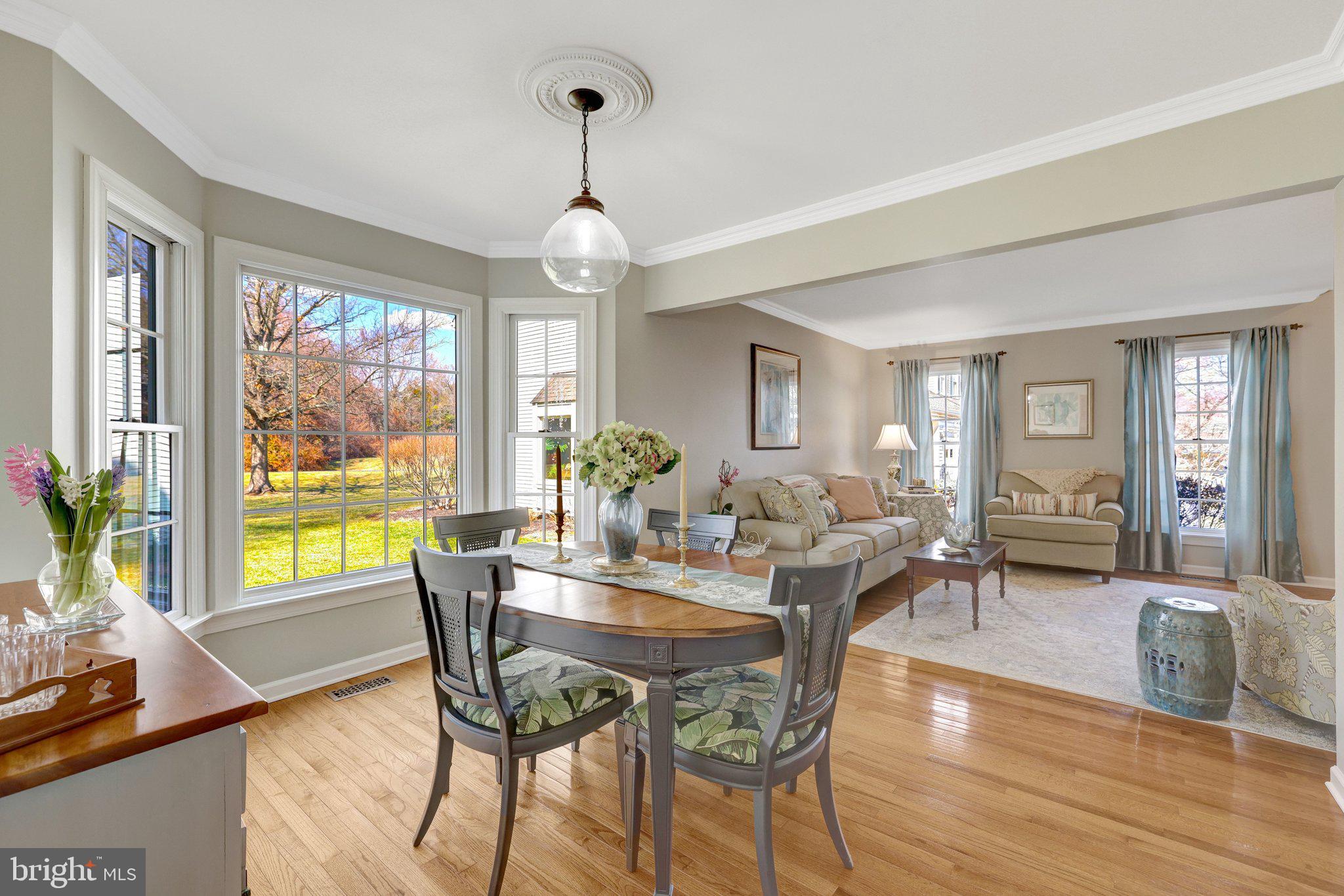 21039 Barcroft Way Sterling, VA 20164 - Photo 12 of 63 a view of a dining room with furniture wooden floor and chandelier