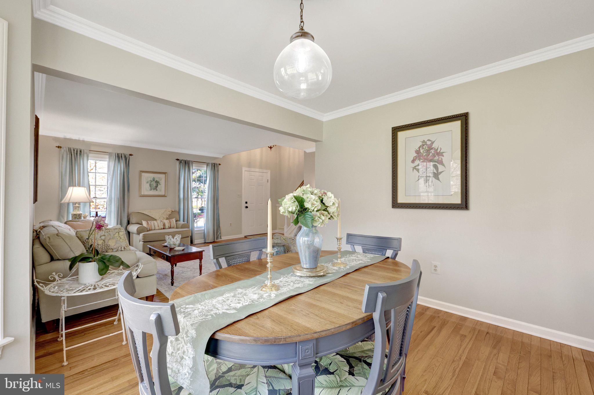 21039 Barcroft Way Sterling, VA 20164 - Photo 13 of 63 a view of a dining room with furniture and wooden floor