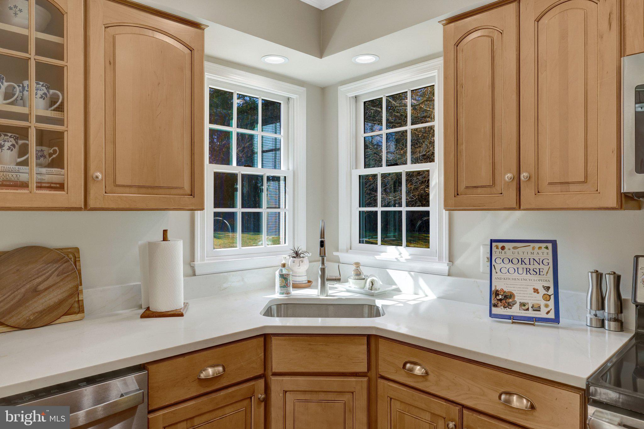 21039 Barcroft Way Sterling, VA 20164 - Photo 17 of 63 a kitchen with stainless steel appliances granite countertop a sink and a window